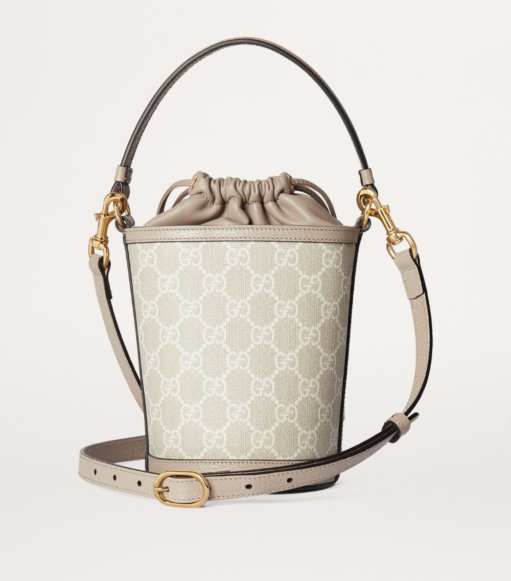 OPHIDIA MINI BUCKET BAG - NUDE