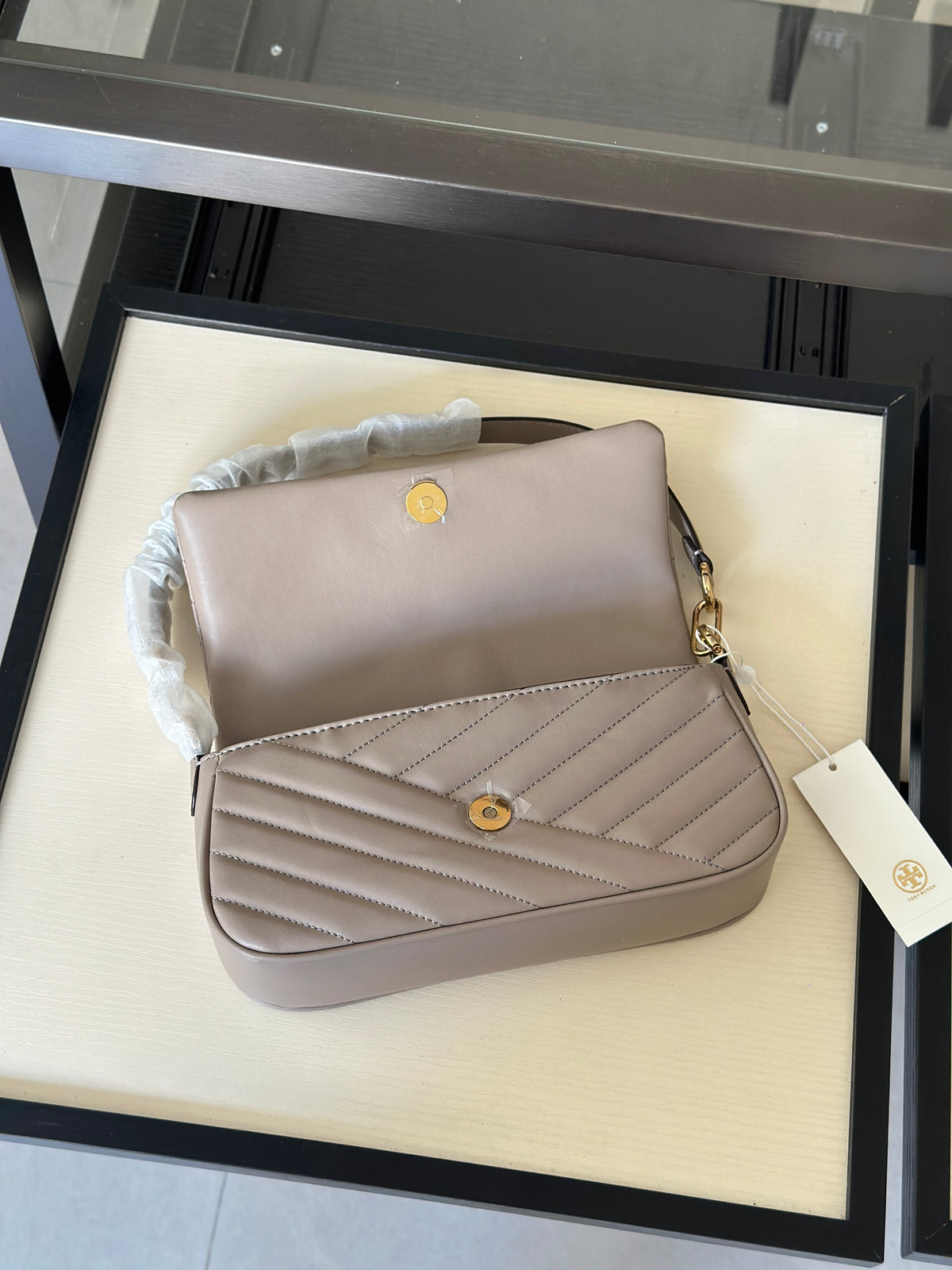 THE KIRA CHEVRON SMALL FLAP SHOULDER BAG - STONE