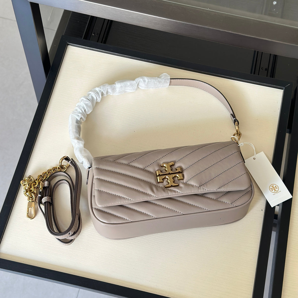 THE KIRA CHEVRON SMALL FLAP SHOULDER BAG - STONE