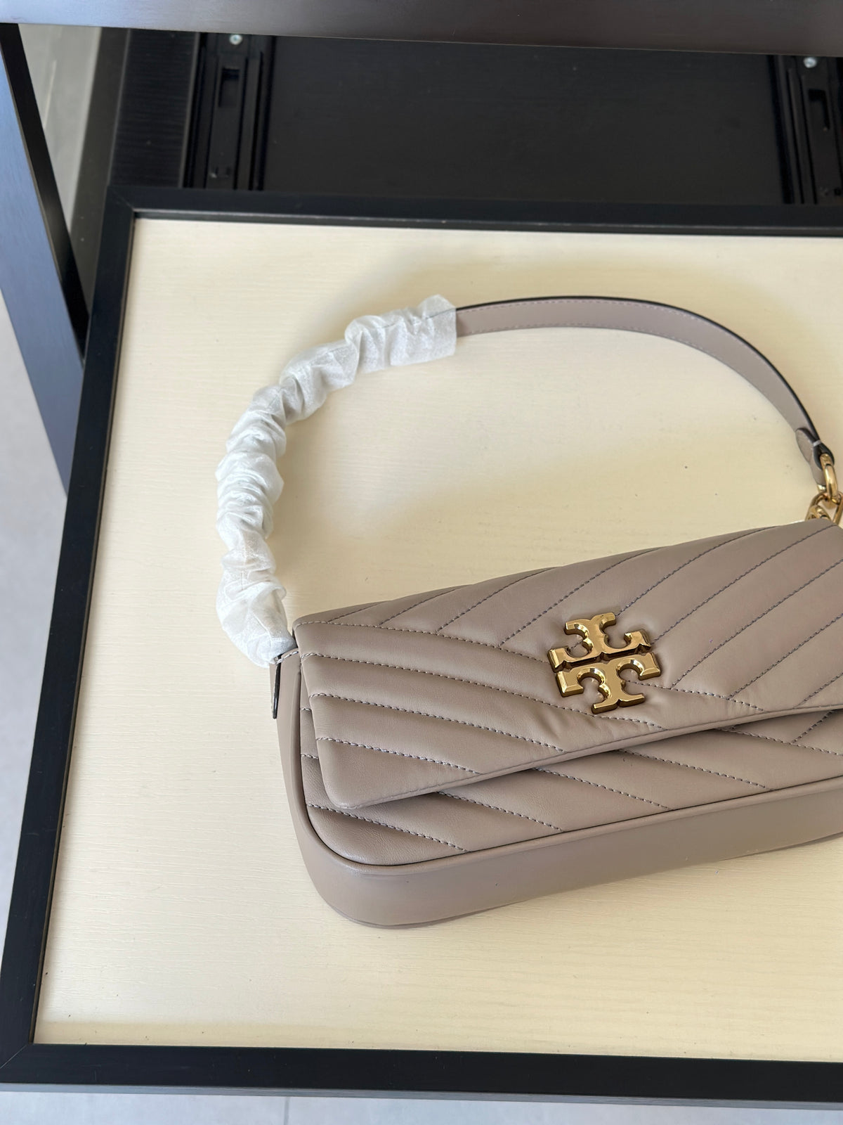 THE KIRA CHEVRON SMALL FLAP SHOULDER BAG - STONE