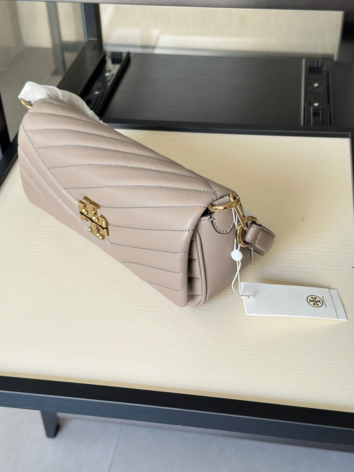 THE KIRA CHEVRON SMALL FLAP SHOULDER BAG - STONE