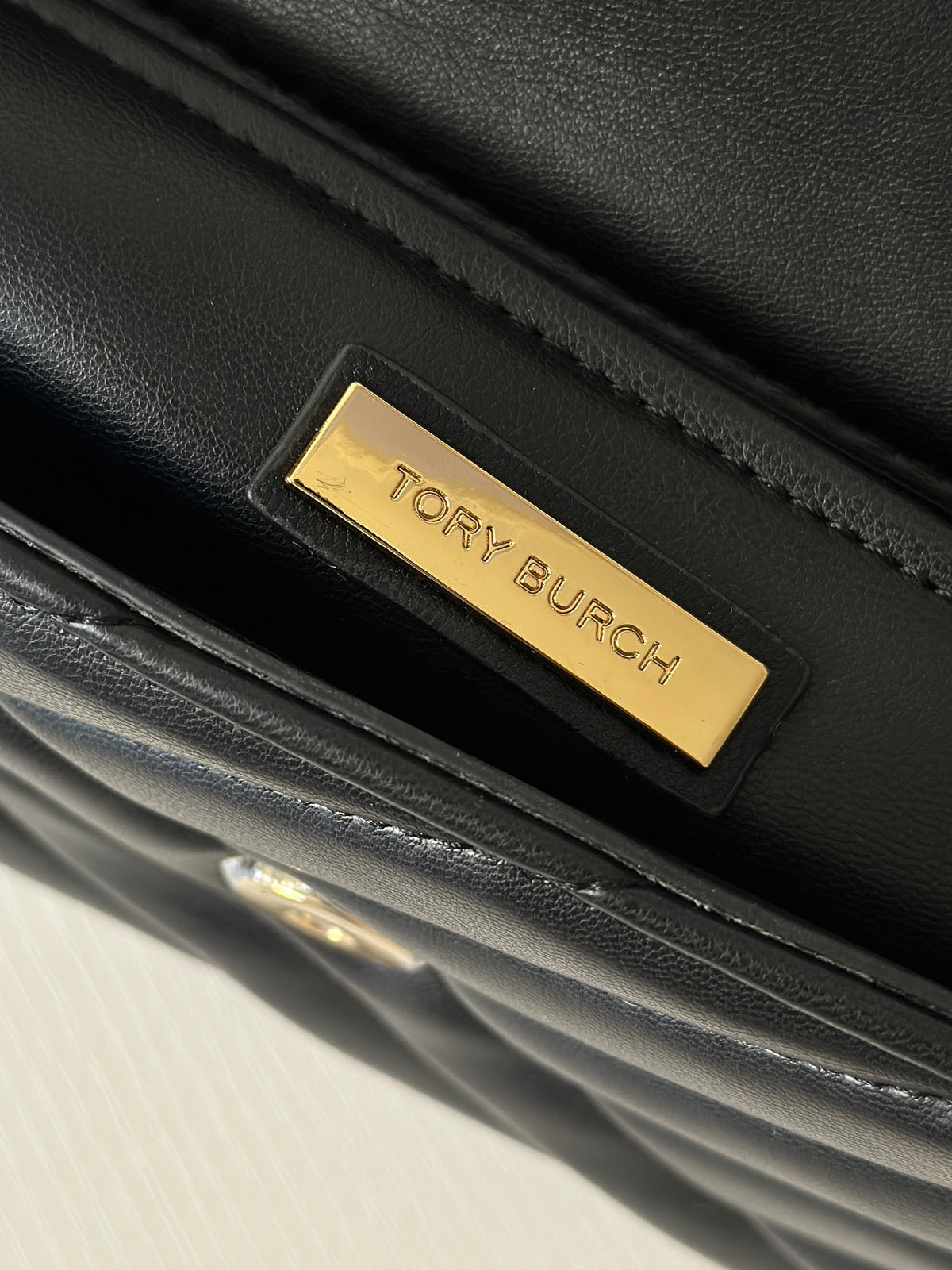 THE KIRA CHEVRON SMALL FLAP SHOULDER BAG - BLACK